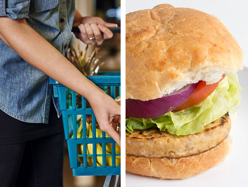 Shopper with a grocery basket and a chicken burger sandwich