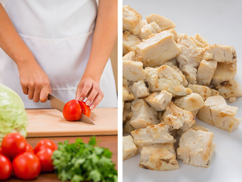 Chef chopping fresh vegetables beside a plate of diced cooked chicken